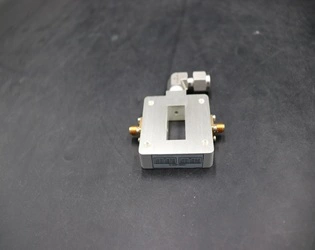 How is the coupling strength of a waveguide probe coupler adjusted?